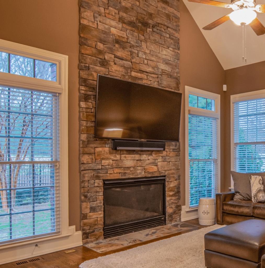 floor to ceiling stone fireplace remodel