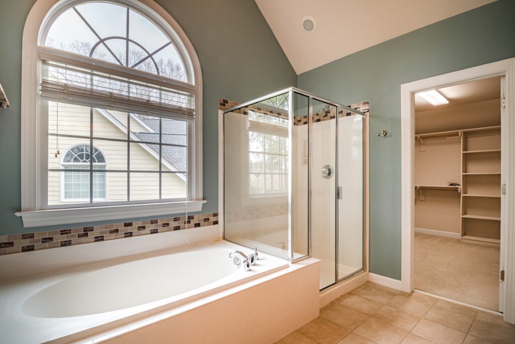 master bathroom showing tub and shower