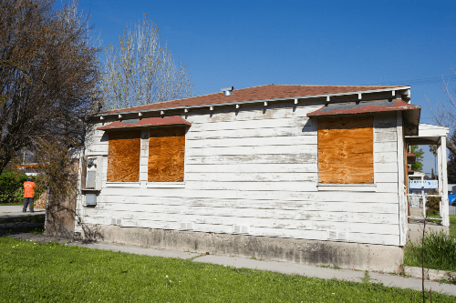 boarded windows on white house