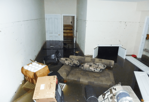 image of flooded basement with submerged furniture