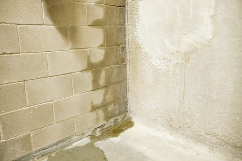 Rain water leaking on cinder block wall